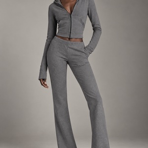 High-fashion model wearing The Sculpt Hooded Flare Set in grey